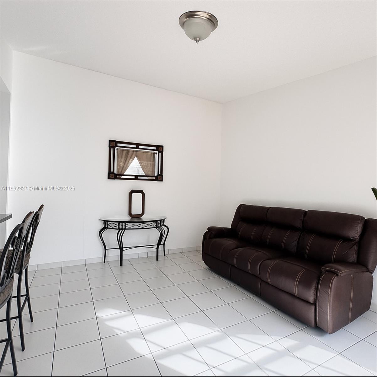 2849 West 71st Street Hialeah, FL 33018 - Photo 6 of 22 a living room with furniture