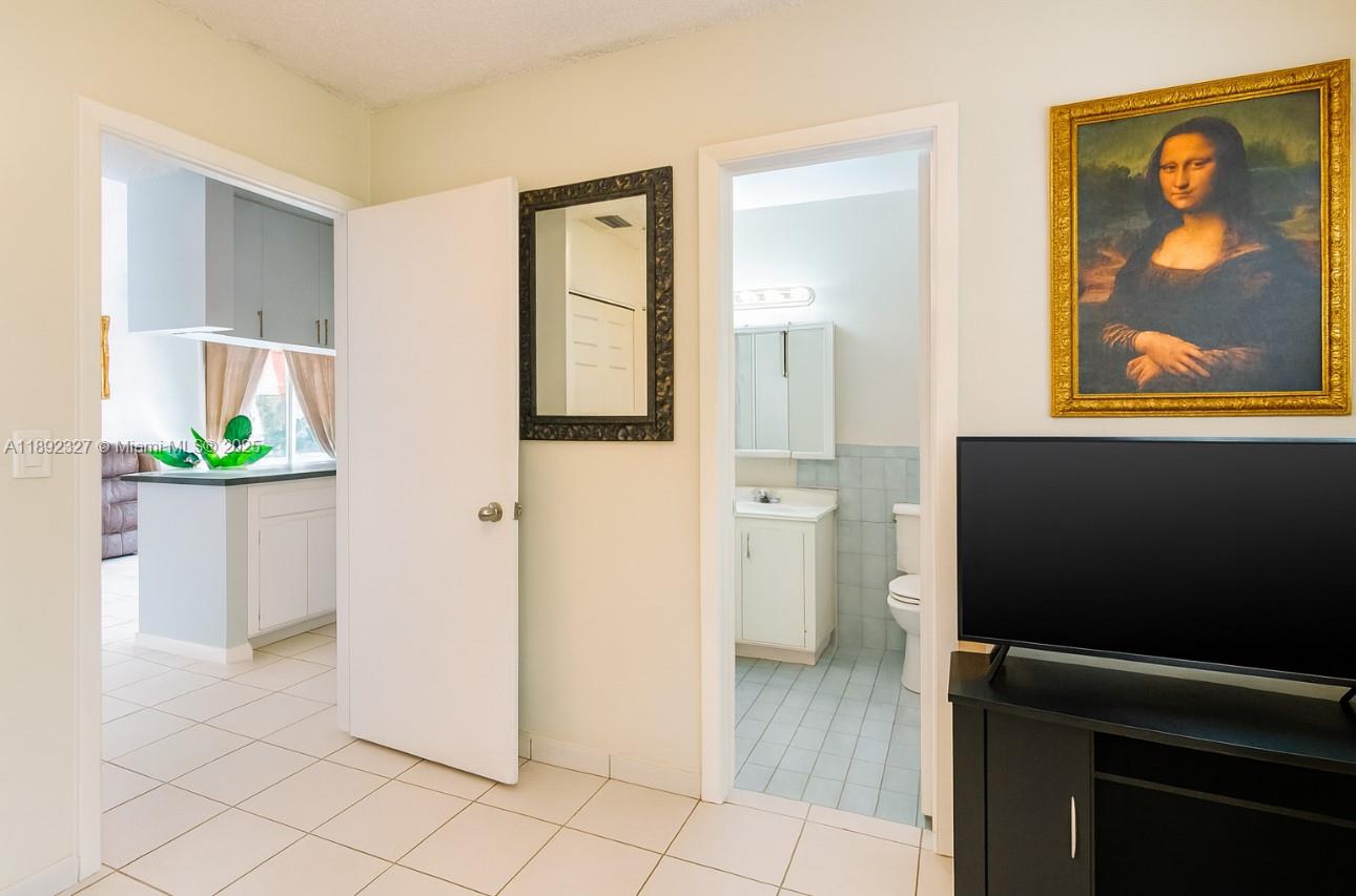 2849 West 71st Street Hialeah, FL 33018 - Photo 9 of 22 a view of a kitchen from the hallway
