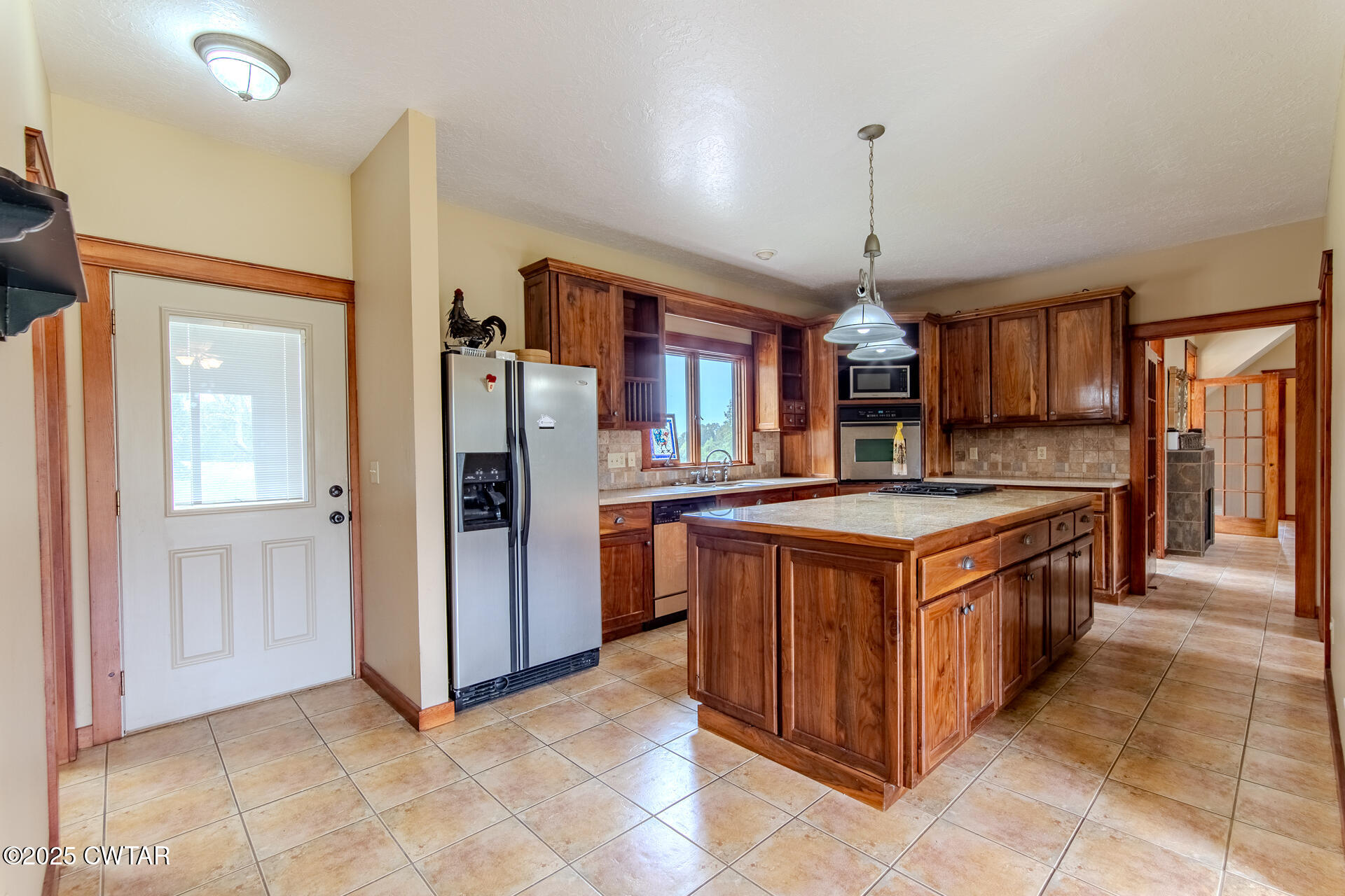 3554 Shades Bridge Road Greenfield, TN 38230 - Photo 11 of 49 a kitchen with stainless steel appliances granite countertop a stove and a refrigerator