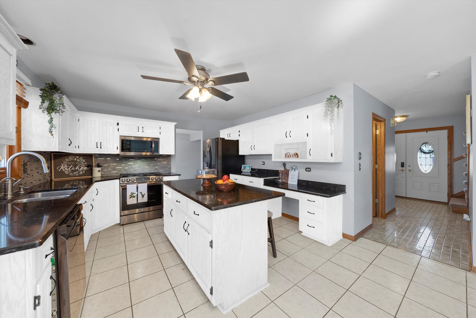 21170 Deerpath Road Frankfort, IL 60423 - Photo 2 of 26 a kitchen with granite countertop a sink a counter top space appliances and cabinets