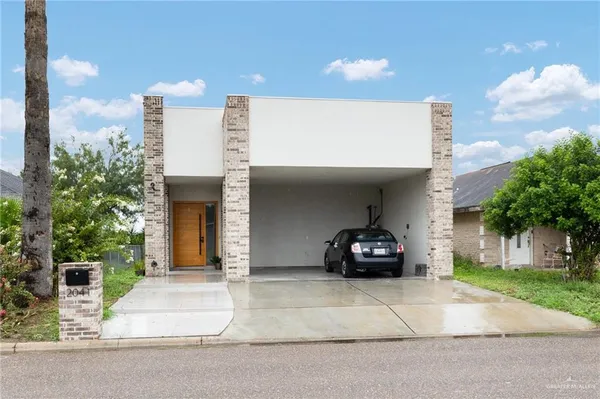 a car parked in front of a house