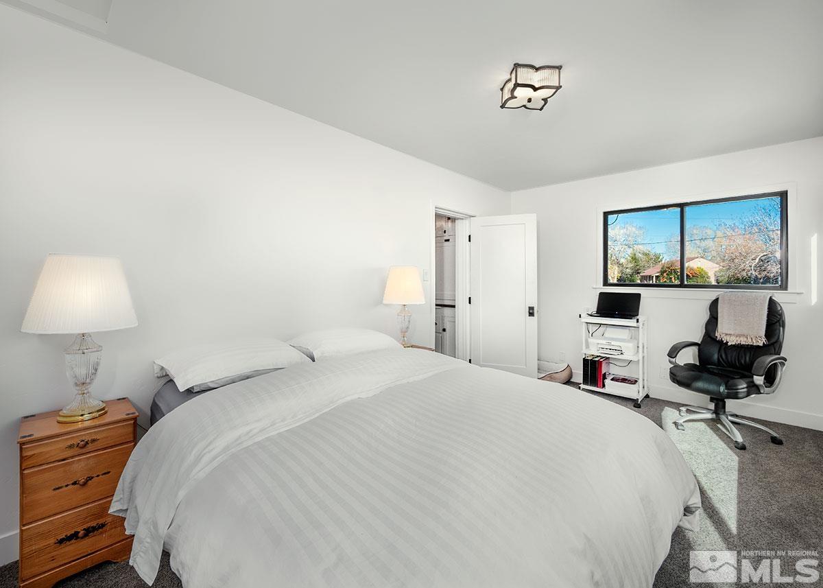 1152 Ralston Street Reno, NV 89503 - Photo 17 of 25 a bedroom with a bed and wooden floor