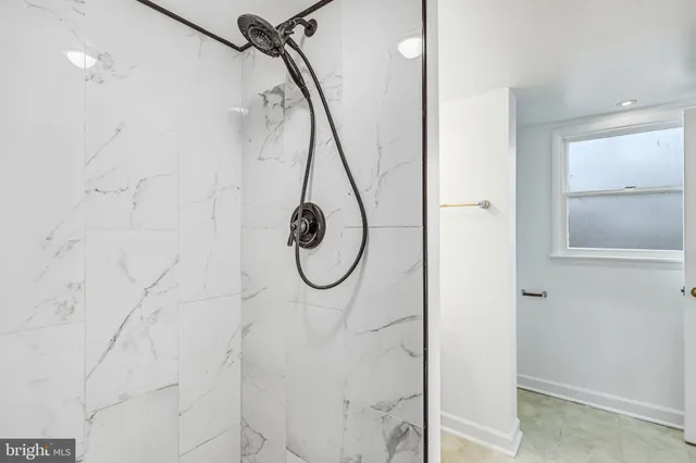 a view of balcony with wooden floor and fence