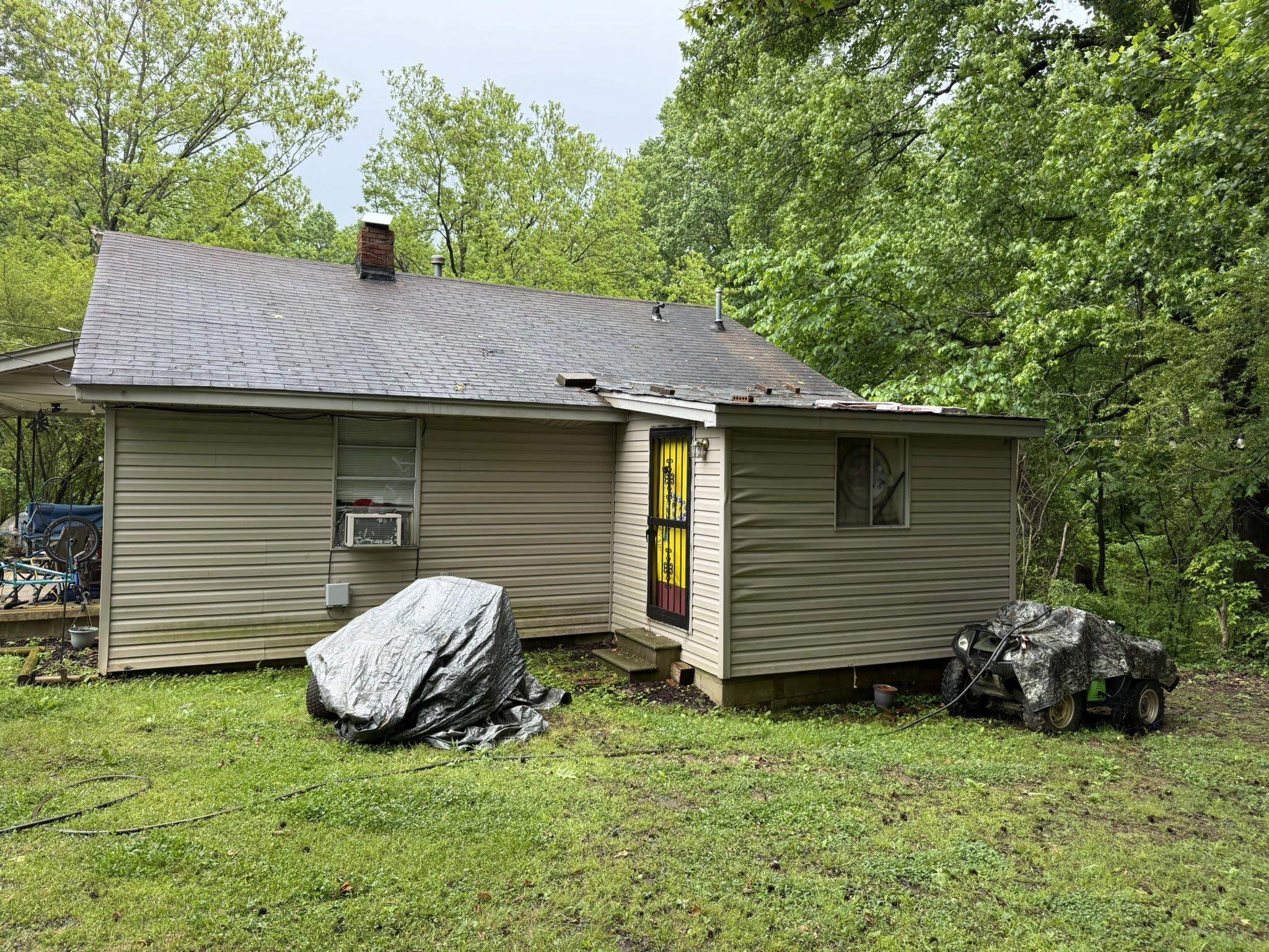 7503 Walsh Road Millington, TN 38053 - Photo 25 of 26 Exterior featuring beige horizontal siding and a dark shingle roof with a brick chimney