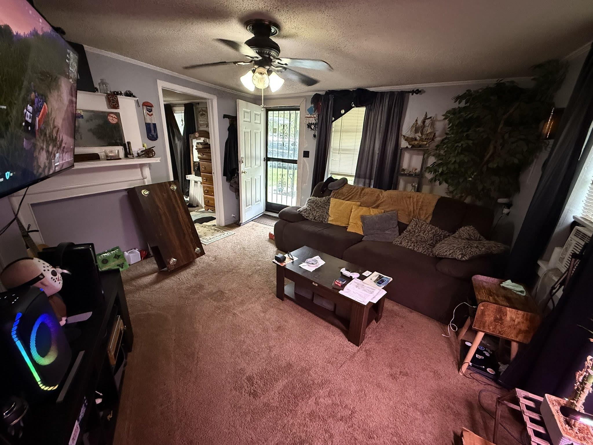 7503 Walsh Road Millington, TN 38053 - Photo 10 of 26 Living room featuring light-colored walls and carpeted flooring