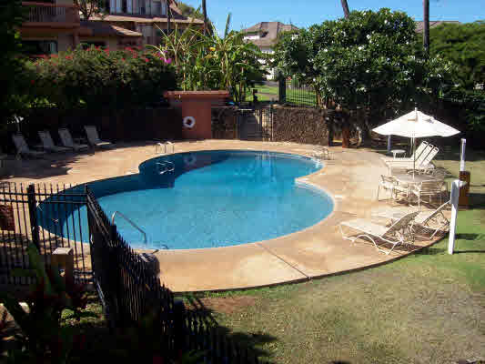 1568 Pe'e Road, Unit 421 Koloa, HI 96756 - Photo 1 of 6 a view of a swimming pool with a patio