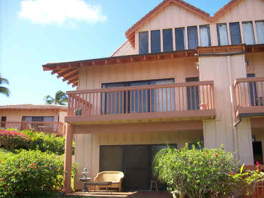 1568 Pe'e Road, Unit 421 Koloa, HI 96756 - Photo 3 of 6 a front view of a house with a yard balcony