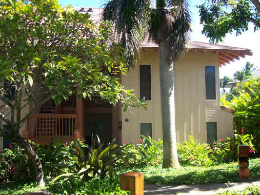 1568 Pe'e Road, Unit 421 Koloa, HI 96756 - Photo 4 of 6 a front view of a house with a garden