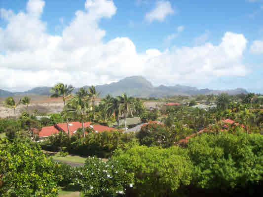 1568 Pe'e Road, Unit 421 Koloa, HI 96756 - Photo 6 of 6 a view of a lake with mountains in the background