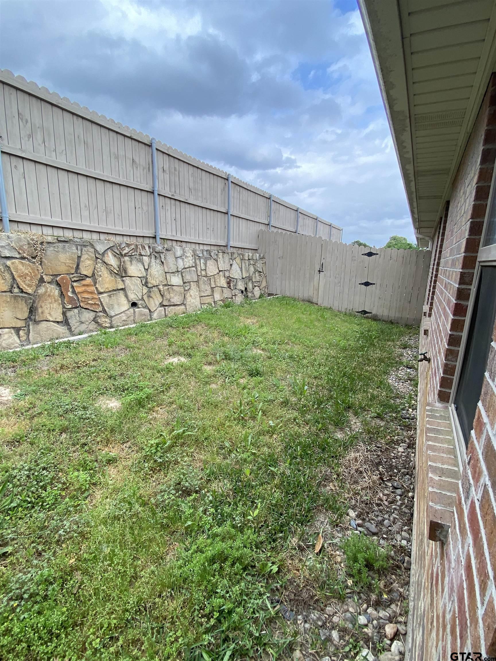 3960 Cottage Drive Tyler, TX 75701 - Photo 11 of 15 a view of a backyard