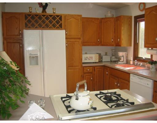 504 Ridge Avenue Springdale, PA 15144 - Photo 3 of 8 Kitchen. The oak kitchen features an island and generous cabinet space.