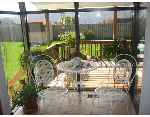 504 Ridge Avenue Springdale, PA 15144 - Photo 7 of 8 Patio/Deck. The glassed breakfast area looks out to a level fenced yard. This hill top lot is impressive.