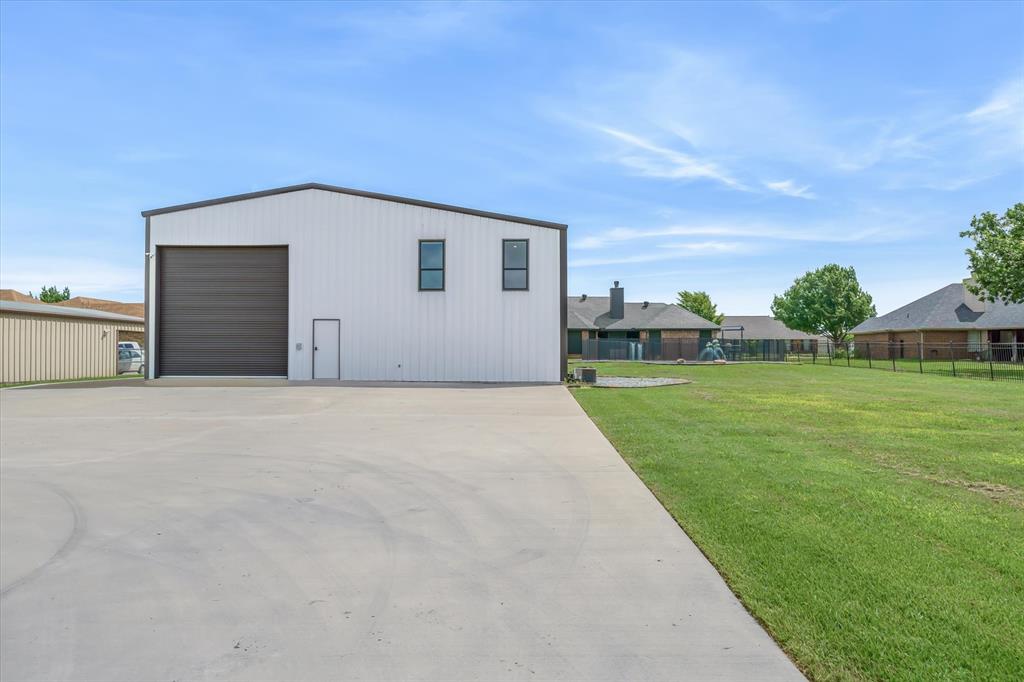 9346 Homestead Lane Forney, TX 75126 - Photo 36 of 39 An added feature is an outdoor 220/240 disconnect ready to be wired for your RV, air compressor, or welder. This 60 X 70 concrete space is great for work or play. How about a sport court?