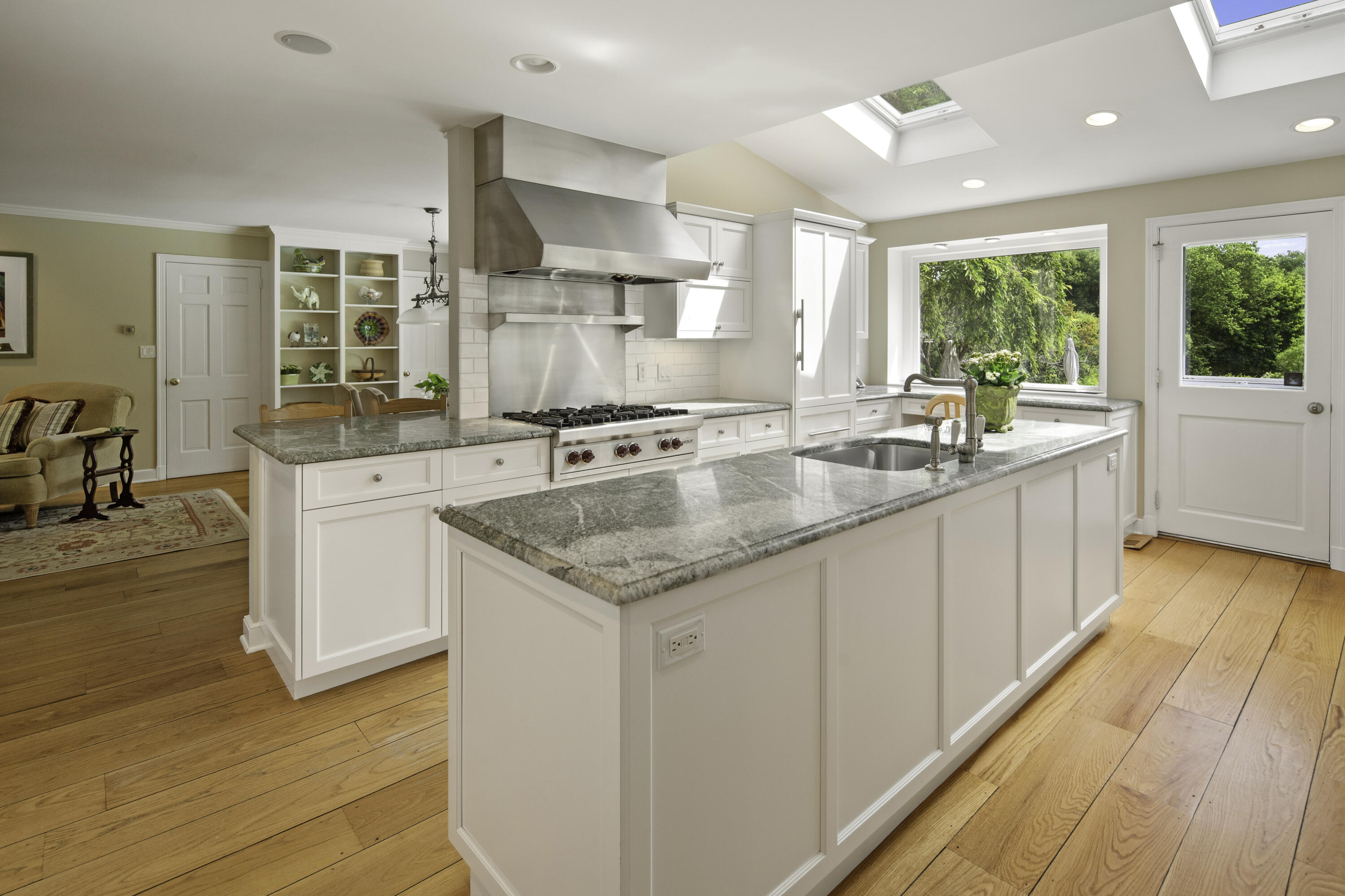 246 White Oak Shade Road New Canaan, CT 06840 - Photo 12 of 38 a kitchen with a sink stove and cabinets