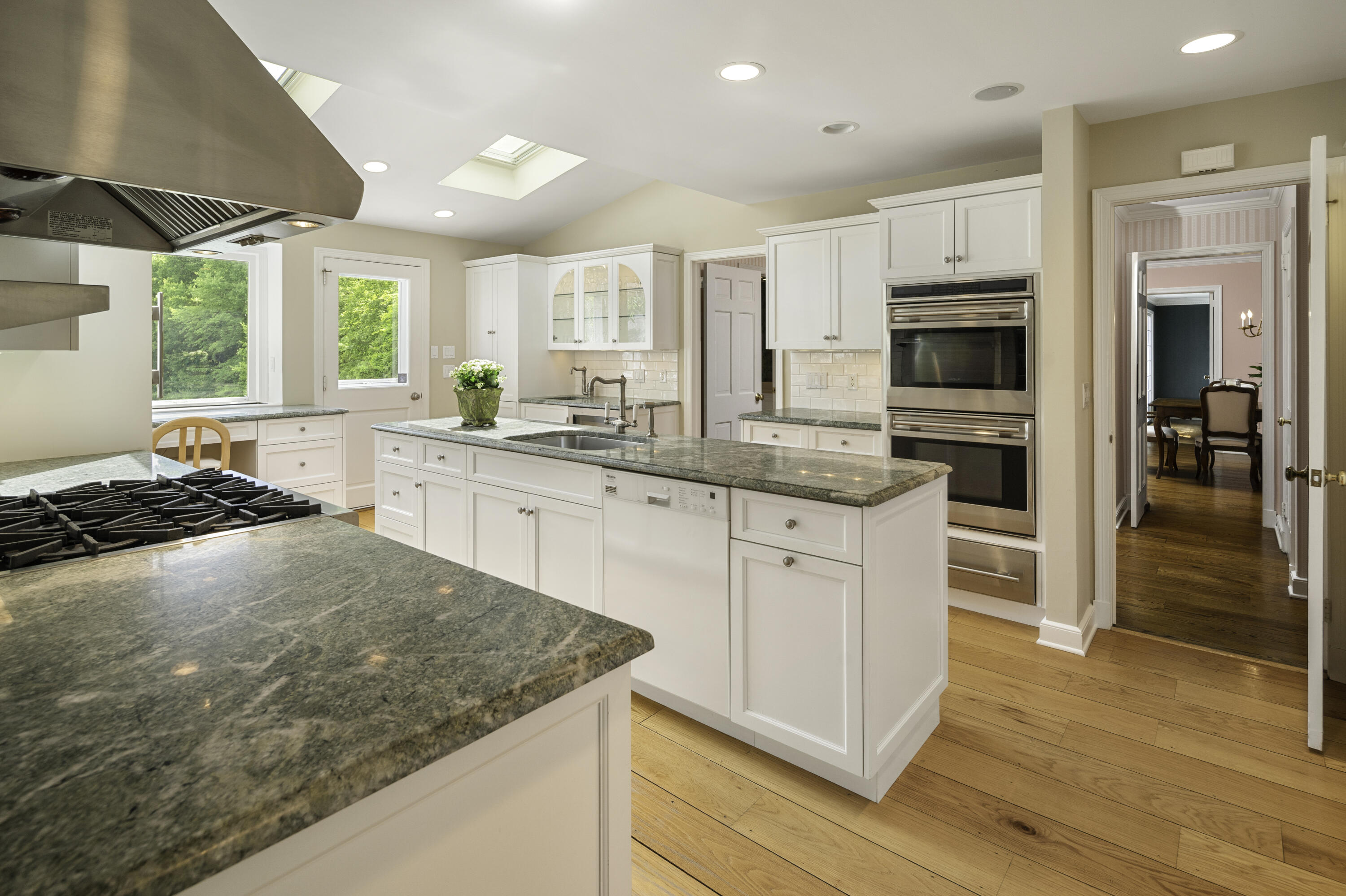 246 White Oak Shade Road New Canaan, CT 06840 - Photo 13 of 38 a kitchen with stainless steel appliances granite countertop a stove a sink and a refrigerator