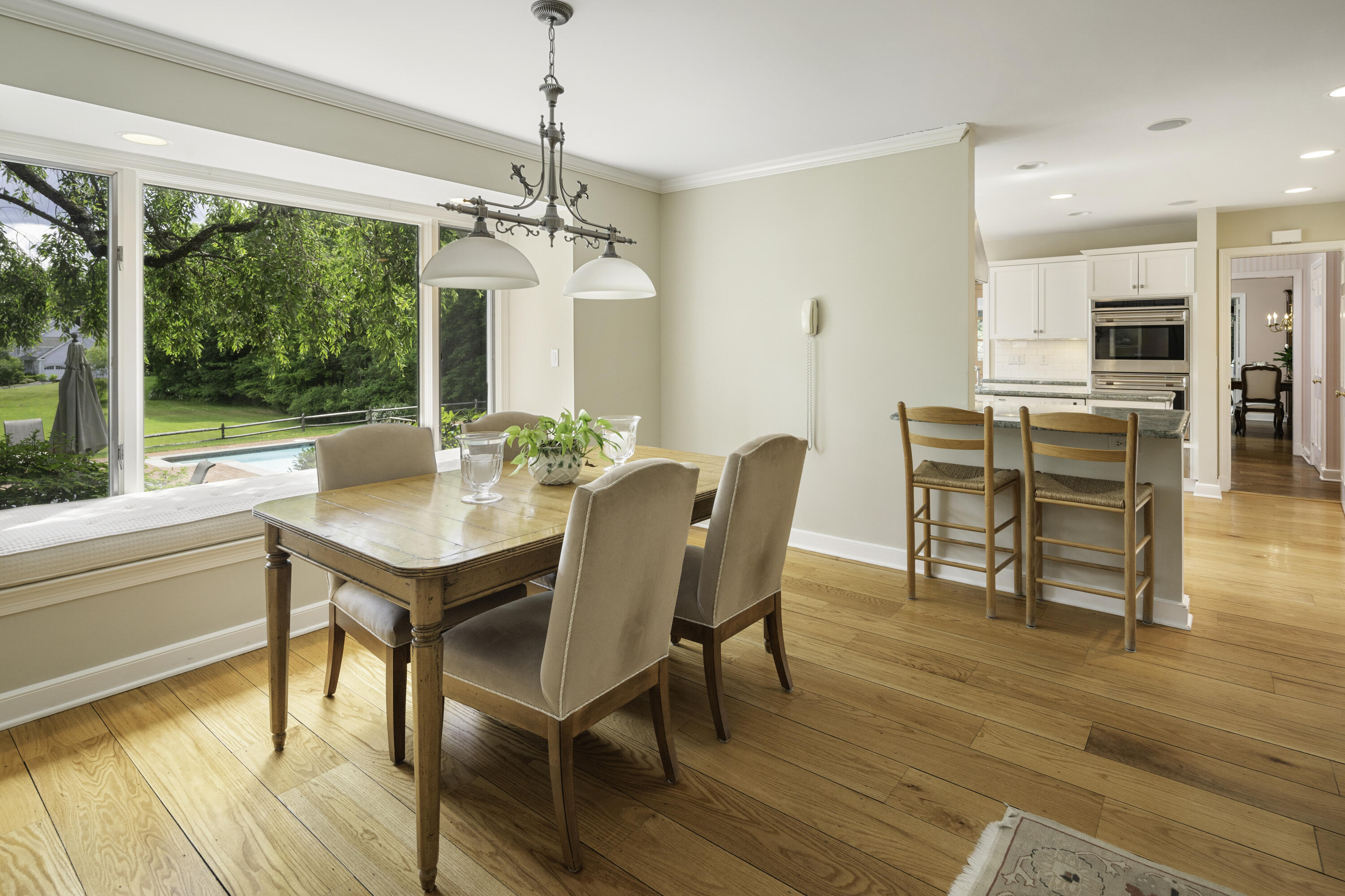 246 White Oak Shade Road New Canaan, CT 06840 - Photo 15 of 38 a view of a dining room with furniture window and wooden floor