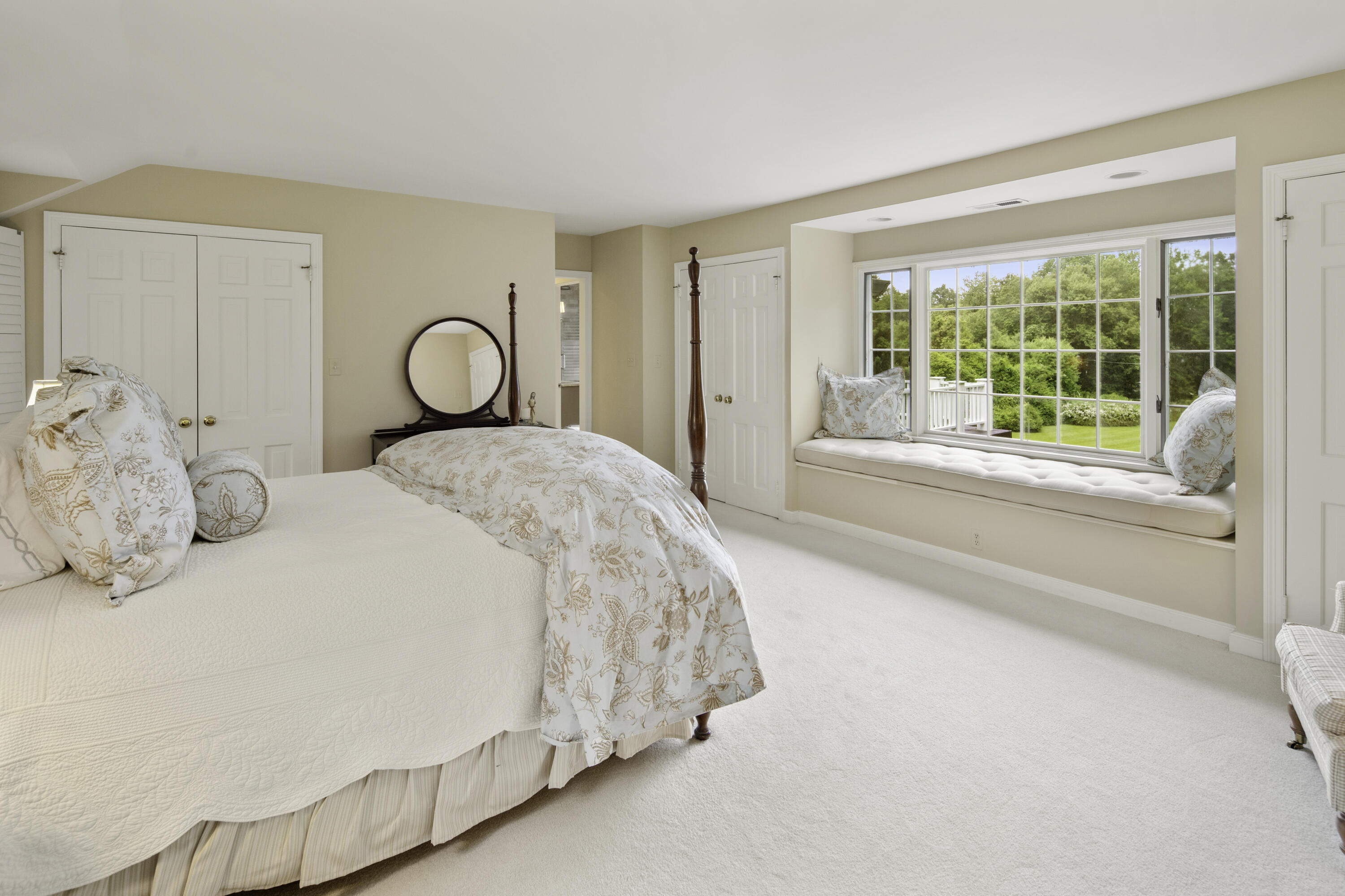 246 White Oak Shade Road New Canaan, CT 06840 - Photo 22 of 38 a spacious bedroom with a bed and a large window
