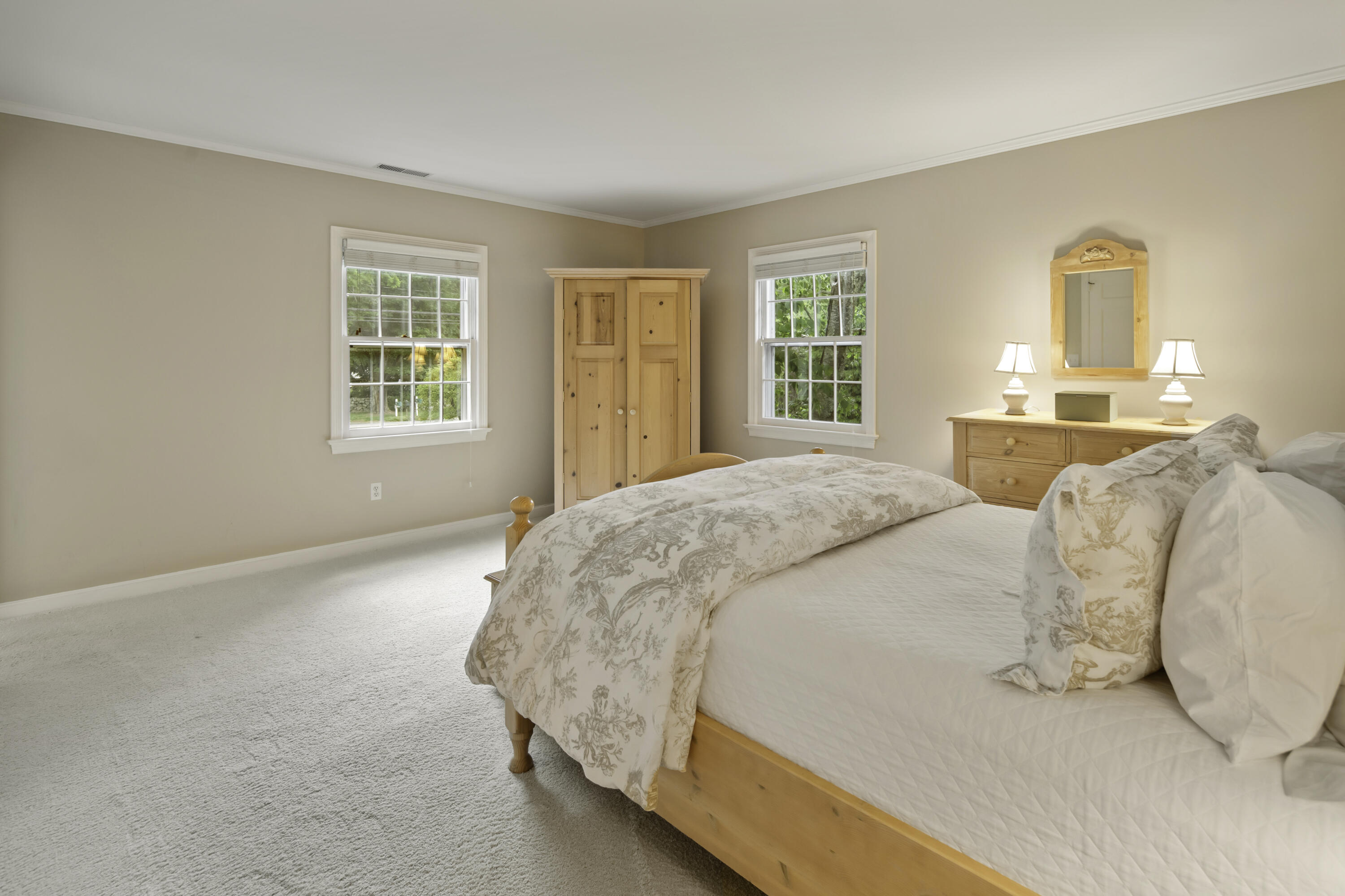 246 White Oak Shade Road New Canaan, CT 06840 - Photo 24 of 38 a spacious bedroom with a bed and window