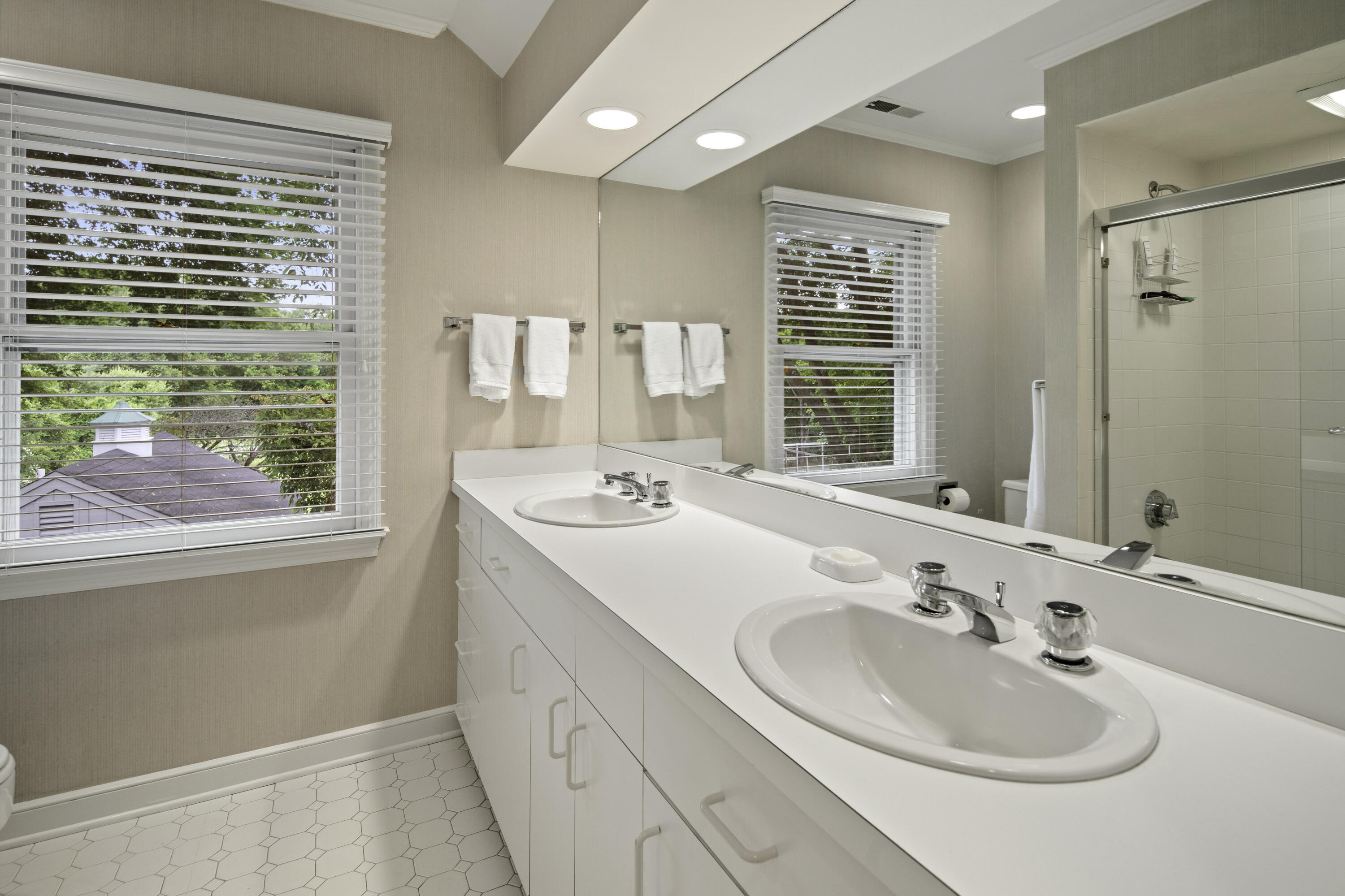 246 White Oak Shade Road New Canaan, CT 06840 - Photo 29 of 38 a bathroom with a sink double vanity and a mirror