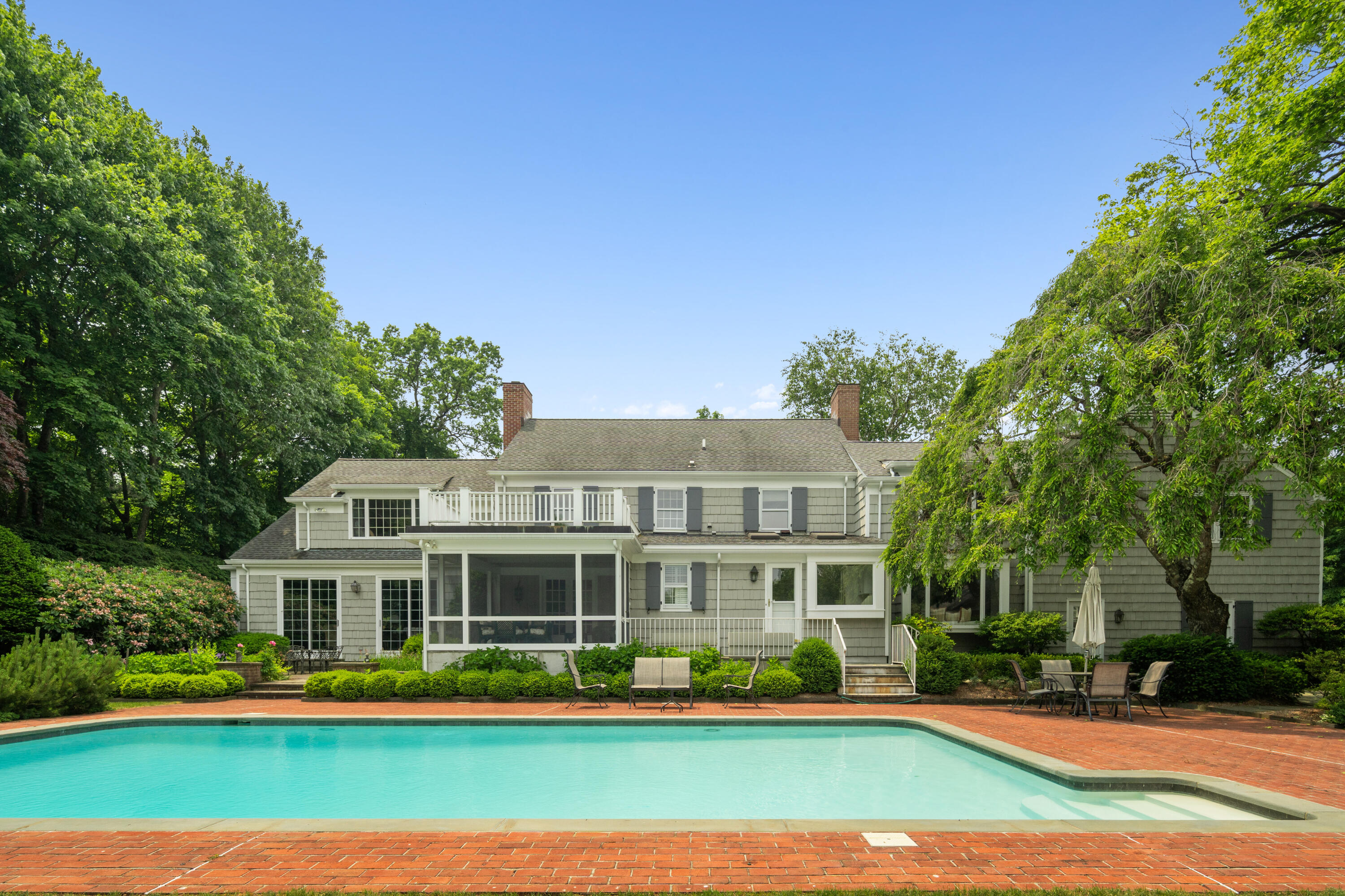 246 White Oak Shade Road New Canaan, CT 06840 - Photo 30 of 38 a front view of a house with a yard