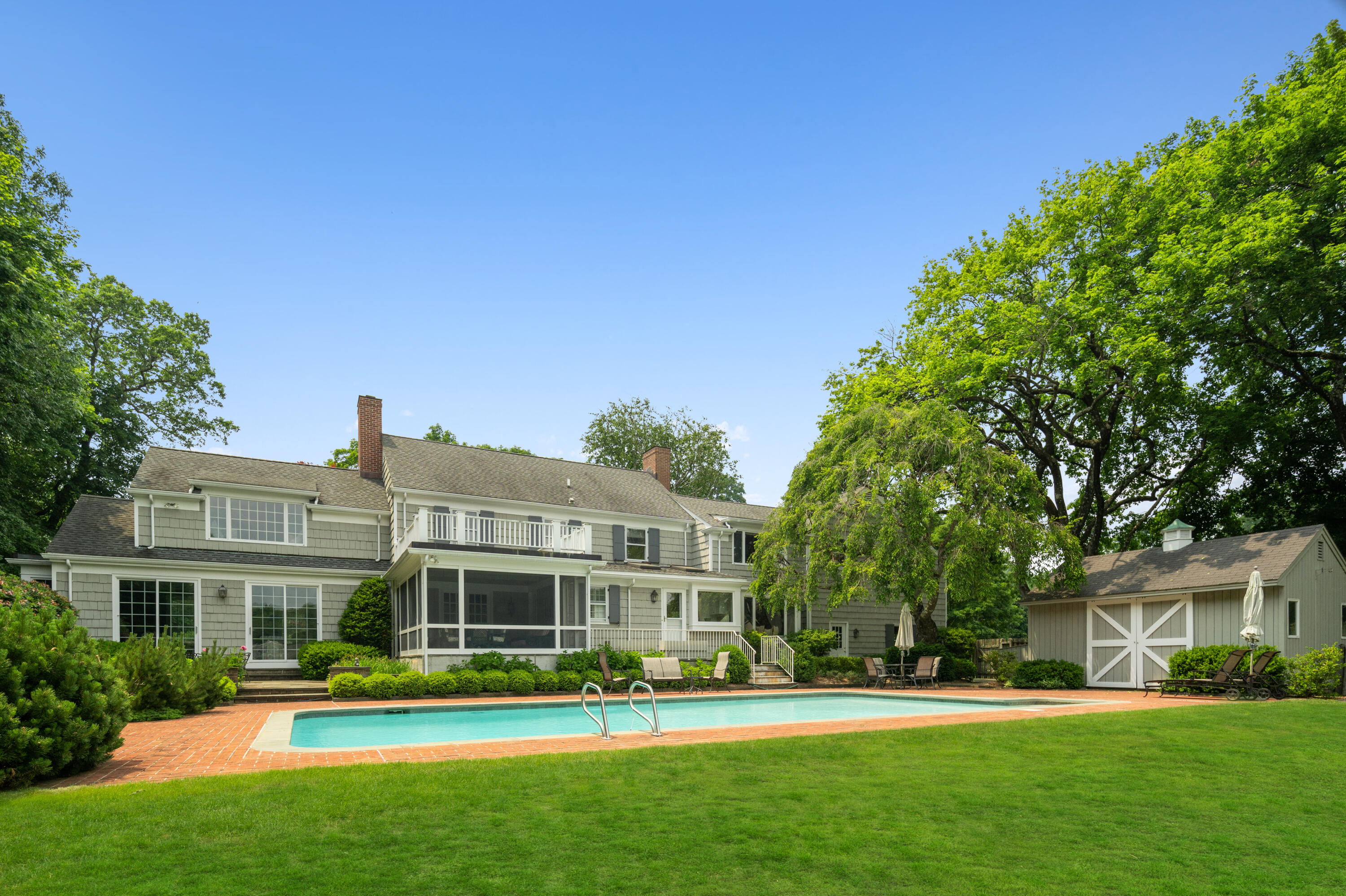 246 White Oak Shade Road New Canaan, CT 06840 - Photo 32 of 38 a front view of building with yard and green space