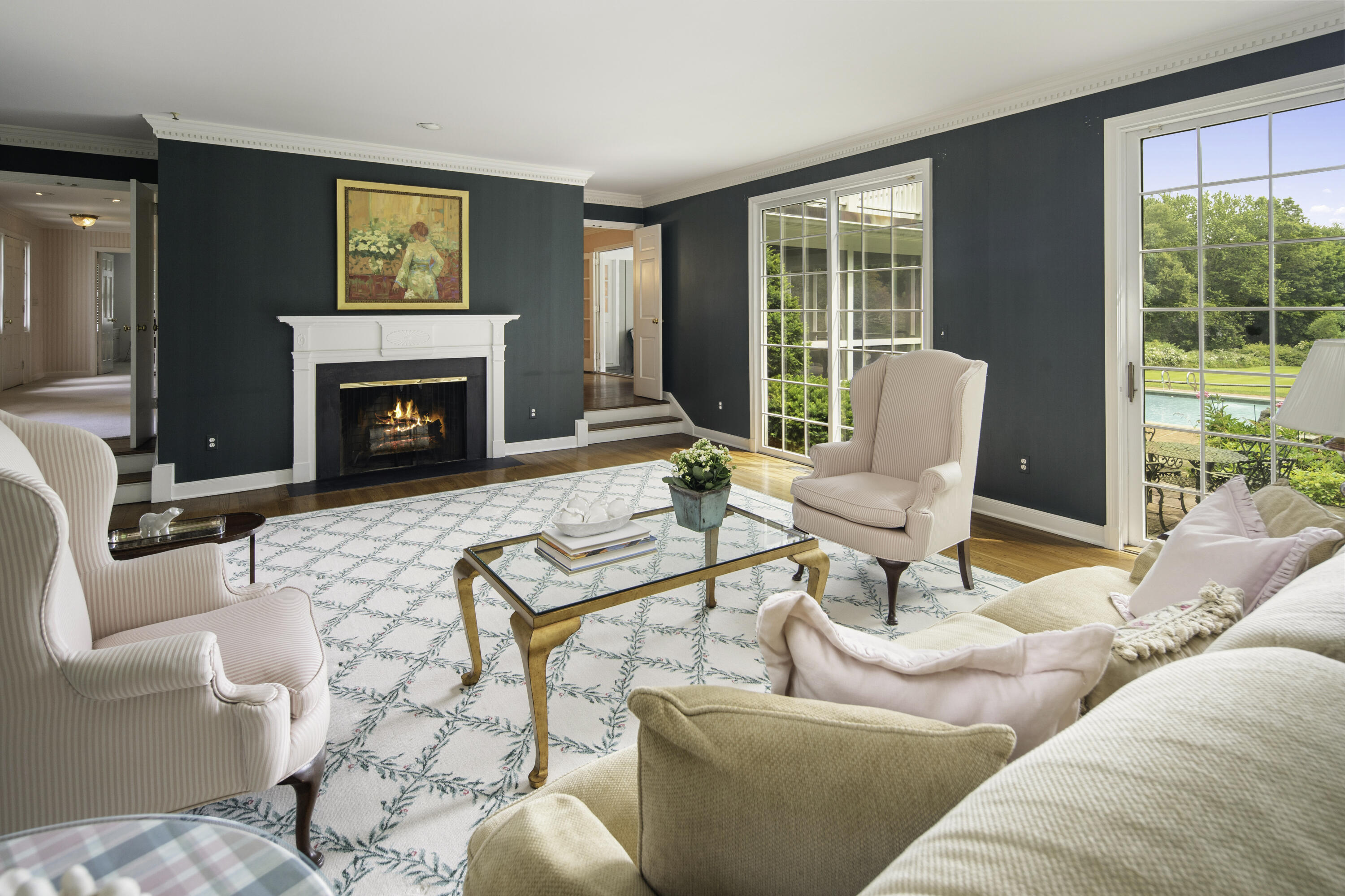 246 White Oak Shade Road New Canaan, CT 06840 - Photo 9 of 38 a living room with furniture a fireplace and a large window