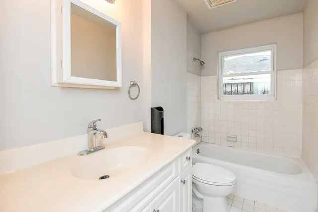 a bathroom with a sink and a bathtub