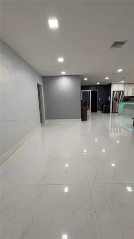 a kitchen with a stove and a refrigerator