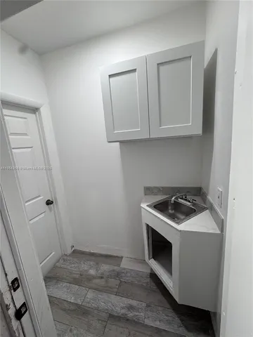 a view of outdoor space with wooden floor