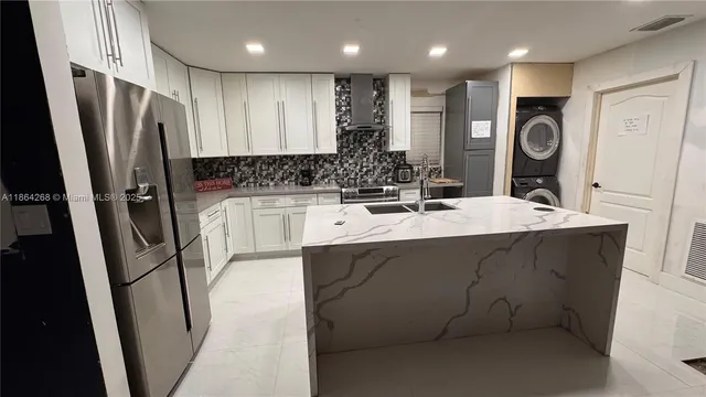 a bathroom with a sink a toilet a mirror and shower