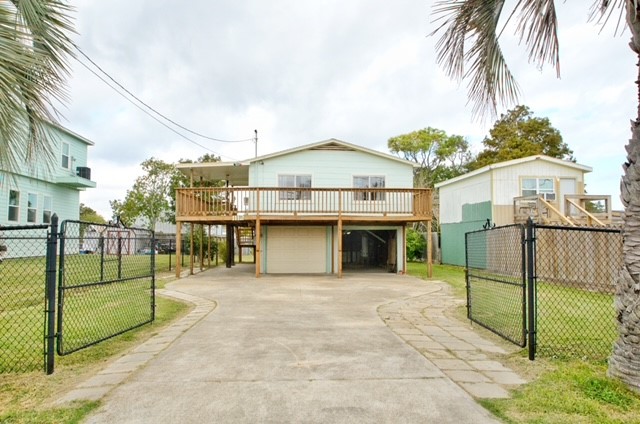 1112 7th Street San Leon, TX 77539 - Photo 3 of 14 a view of a house with a backyard