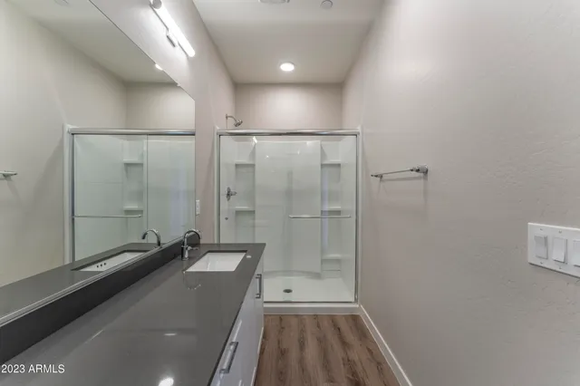 a bathroom with a sink and a mirror
