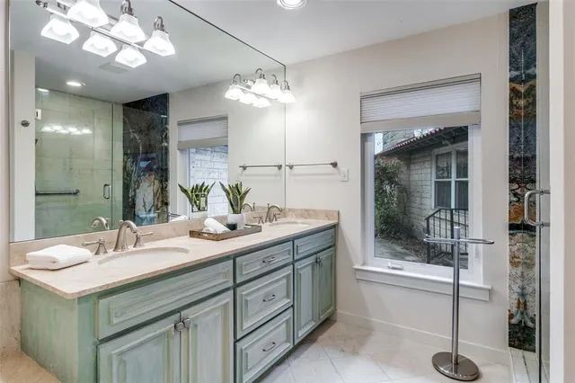 a bathroom with a sink vanity and a mirror