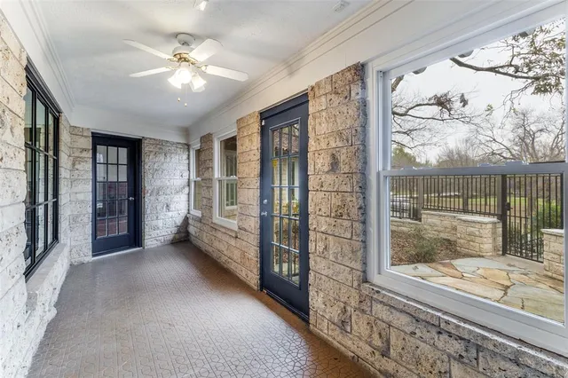 a view of an entryway with a floor to ceiling window and a livingroom