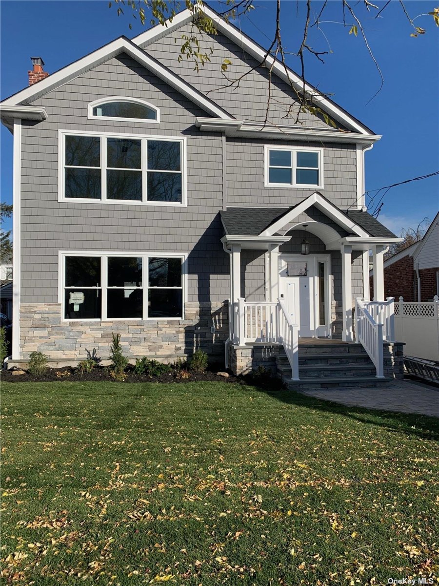 444 Emory Road Mineola, NY 11501 - Photo 1 of 1 a front view of a house with a garden