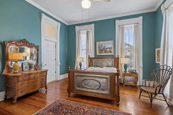 a living room with fireplace furniture and a window