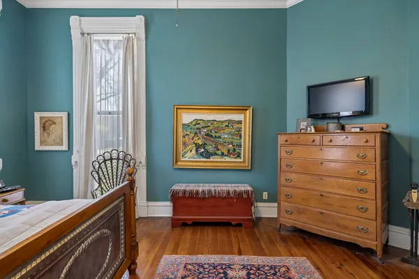 a living room with furniture fireplace and window