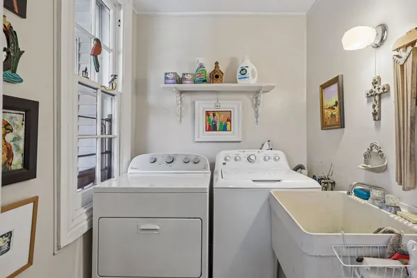 a bedroom with a bed and a dresser in it