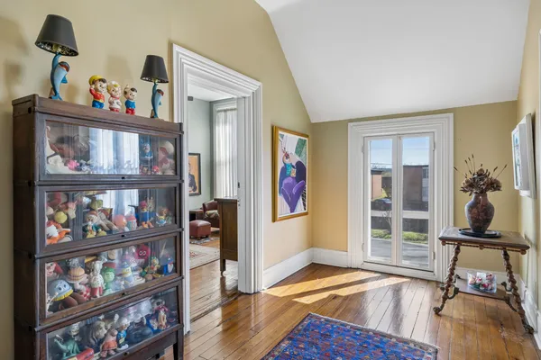 a living room with furniture and kitchen view