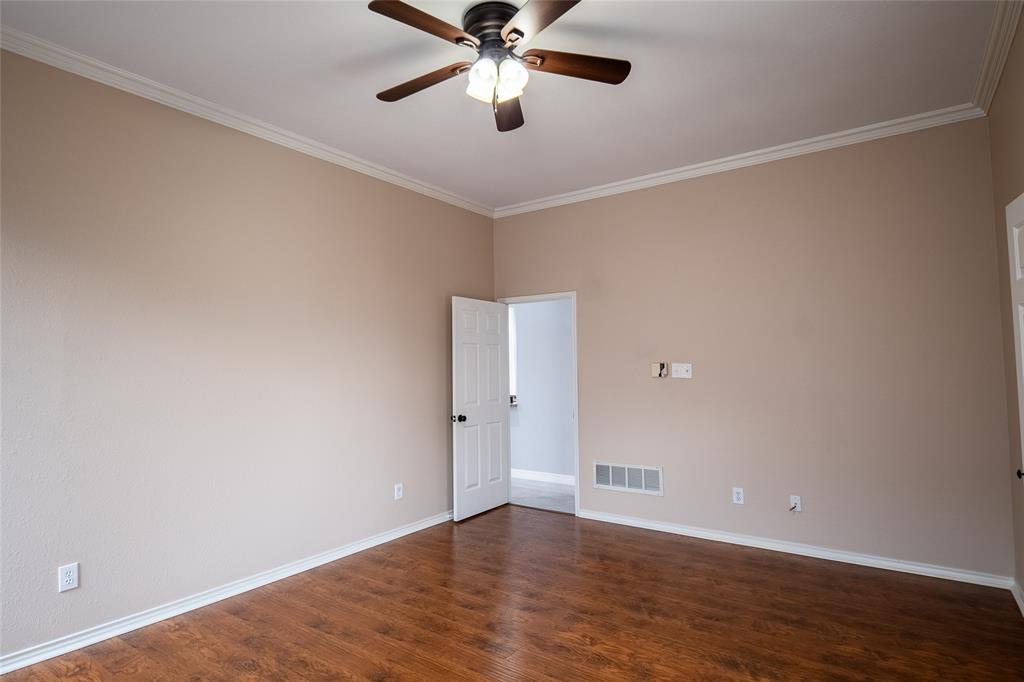 4664 Cherokee Path Carrollton, TX 75010 - Photo 12 of 21 a view of an empty room with wooden floor