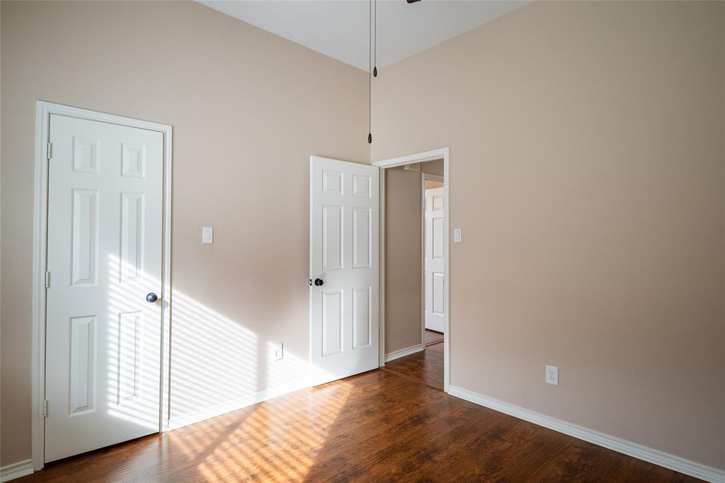 4664 Cherokee Path Carrollton, TX 75010 - Photo 17 of 21 a view of a room with wooden floor and entryway