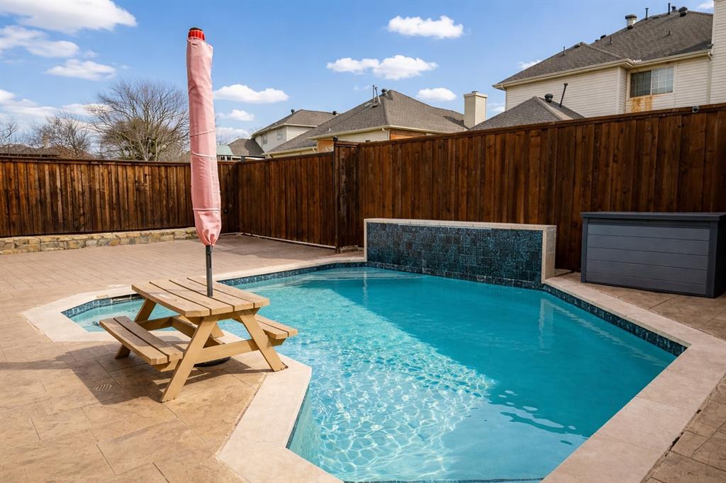 4664 Cherokee Path Carrollton, TX 75010 - Photo 2 of 21 a backyard of a house with table and chairs