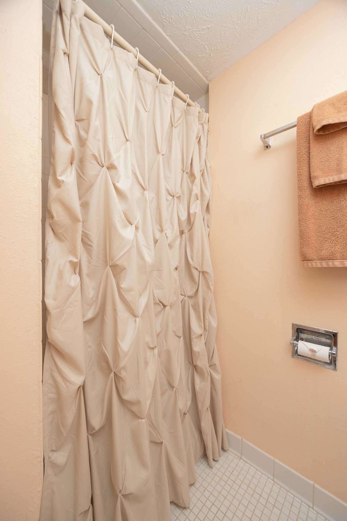 4 Ocean Trace Road, Unit 122 St. Augustine, FL 32080 - Photo 40 of 47 a bathroom with a shower curtain