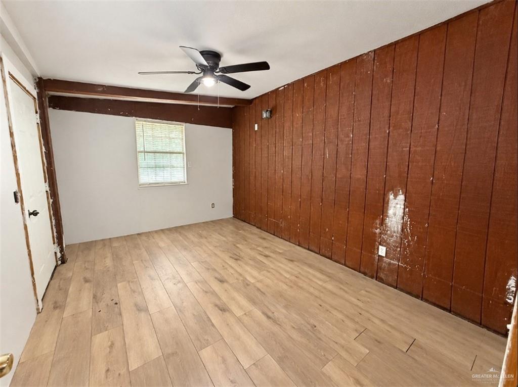0 Fm 1015 Edcouch, TX 78538 - Photo 7 of 20 Wood-finish flooring throughout, ceiling fan with integrated lighting, and a window with blinds