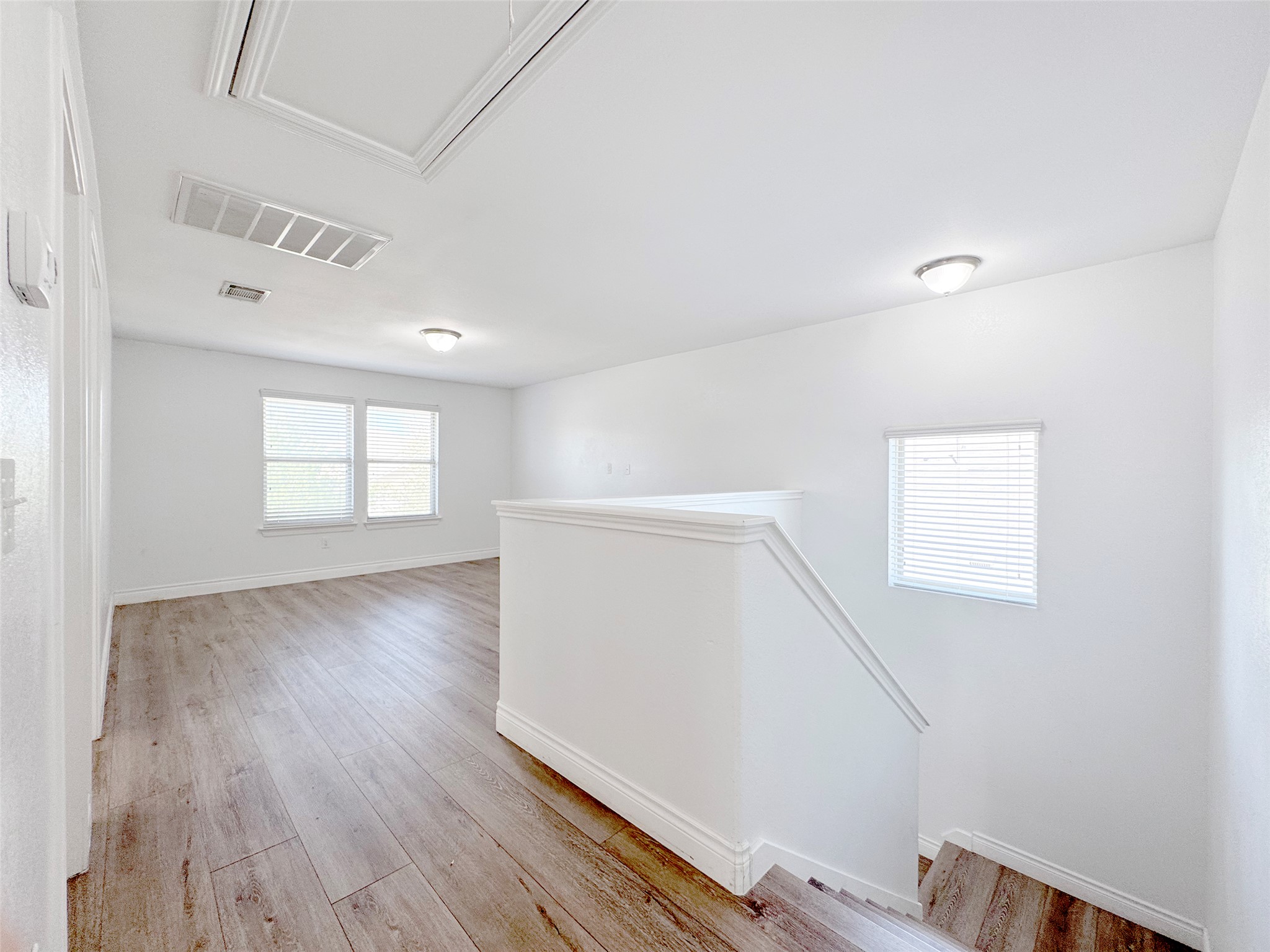 251 Triumph Road Buda, TX 78610 - Photo 13 of 26 Unfurnished room with light wood-type flooring