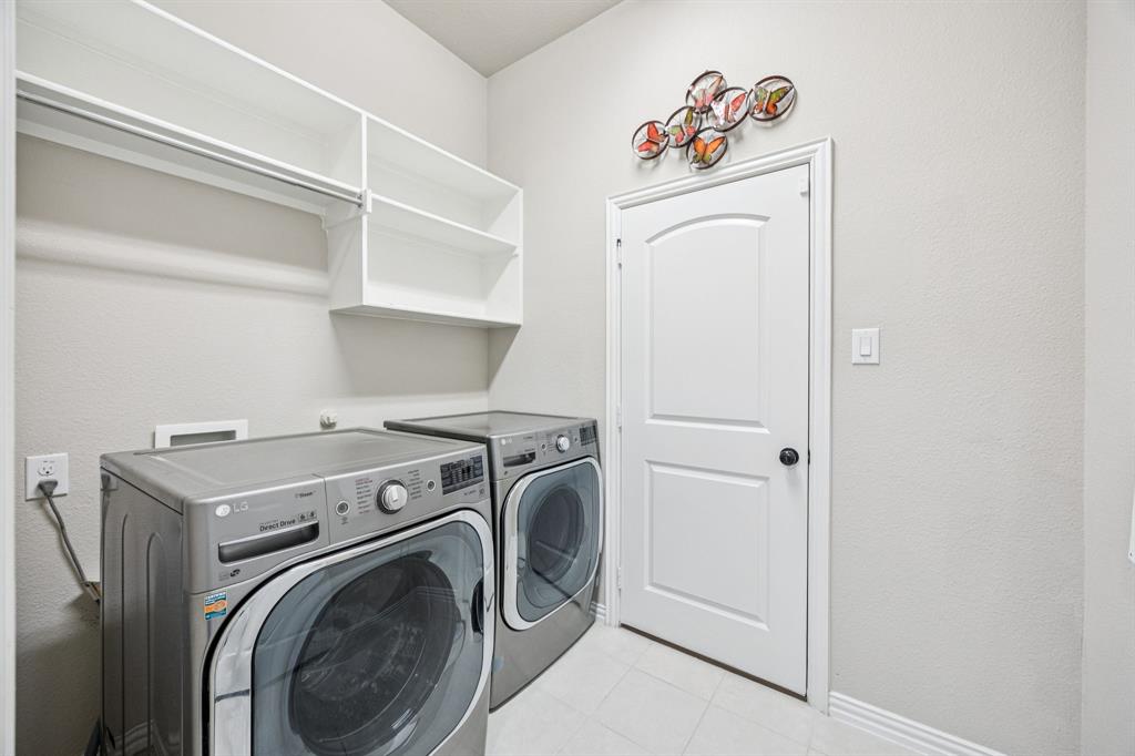 7205 Joshua Tree Trail McKinney, TX 75070 - Photo 13 of 32 a utility room with dryer and washer