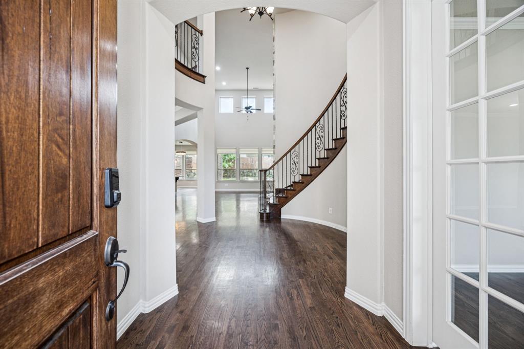 7205 Joshua Tree Trail McKinney, TX 75070 - Photo 14 of 32 a view of entryway and hall with wooden floor