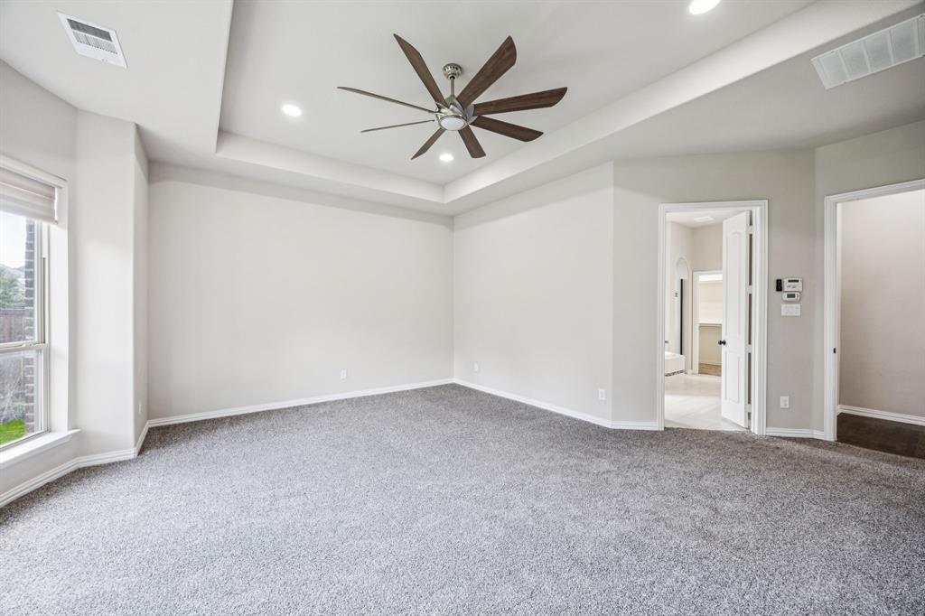 7205 Joshua Tree Trail McKinney, TX 75070 - Photo 16 of 32 an empty room with closet and windows
