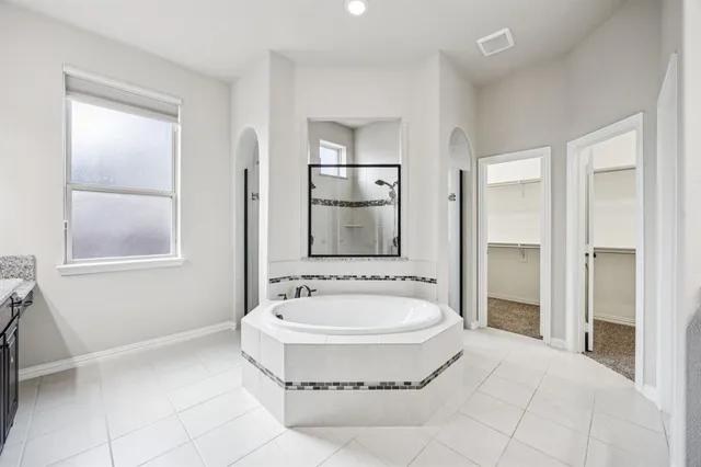 a view of a livingroom with a ceiling fan and window