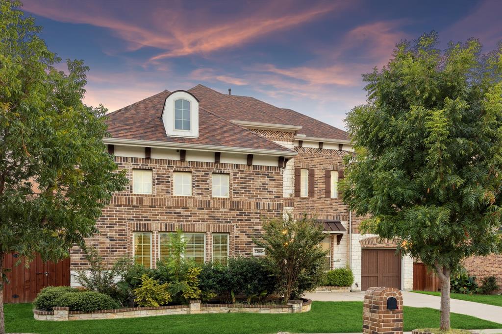 7205 Joshua Tree Trail McKinney, TX 75070 - Photo 2 of 32 a front view of a house with a yard and a tree